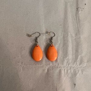 Pink diamond earrings with a triangular design